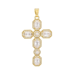 Detail of gold cross pendant with micro-pave cubic zirconia and rectangular gemstones