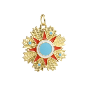 Macro detail of 18k gold plated tarot style sunburst pendant with red and blue enamel