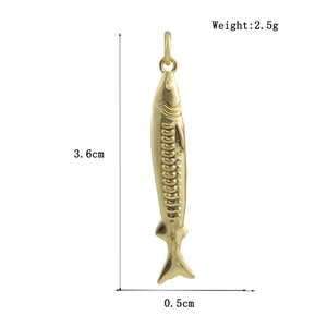 Detailed view of 18k gold plated fish pendant showing fine scales and 3.6cm size