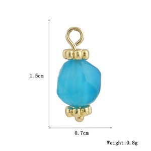 Macro detail of sky blue faceted stone pendant with gold floral caps and size markings