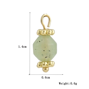 Macro detail of 18k gold plated geometric charm with green stone showing 14mm height