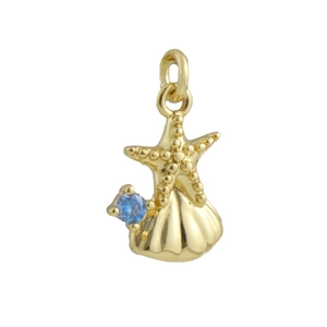Close-up of gold starfish and shell pendant with light blue zircon on white background