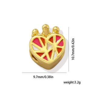 Detailed view of 18k gold plated heart charm with crown top and colorful enamel patterns