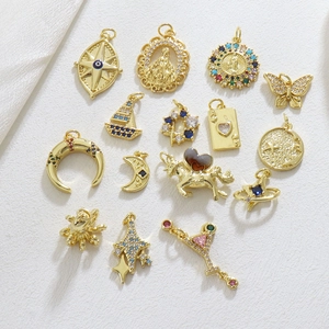 Selection of 15 gold-plated DIY charms with celestial and religious motifs for jewelry
