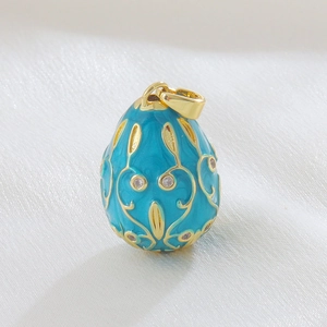 Exquisite 18k gold plated Russian egg pendant with teal enamel and filigree patterns