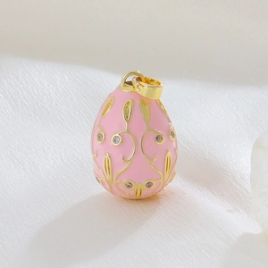 Pink Faberge style 18k gold plated enamel egg pendant with floral crystal inlay