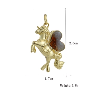 Golden unicorn pendant dimensions showing height 2.6cm and width 1.7cm with heart wing