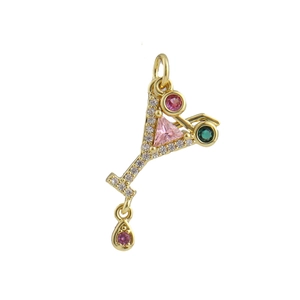 Macro view of a gold-plated cocktail glass pendant with pink stones and micro diamonds