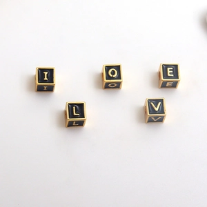 Golden cube letter beads with black enamel and LOVE engraving for DIY jewelry making