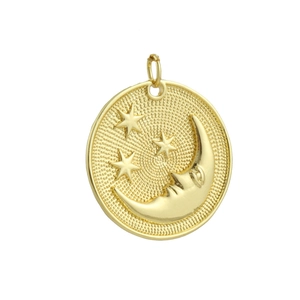 Macro shot of 18k gold-plated round pendant featuring embossed crescent moon and stars