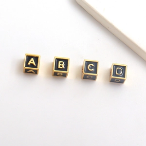 Square black enamel alphabet beads A-D with gold metal letters for DIY jewelry