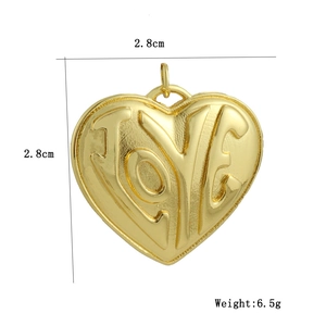 Detailed view of 18k gold-plated heart pendant with LOVE engraving and 2.8cm dimensions