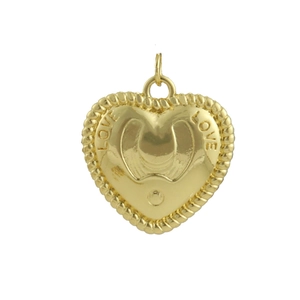 Detail view of a 18k gold heart pendant featuring a horseshoe relief and LOVE engraving