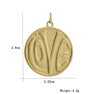 Detail view of a 18k gold plated LOVE heart pendant with dimensions 2.8cm by 2.25cm