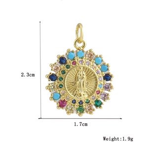 Detailed view of Virgin Mary gold pendant with multi-colored stones 2.3cm x 1.7cm