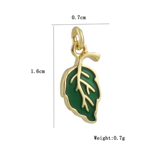 Macro detail of leaf-shaped green enamel charm with 18k gold plating and dimension marks
