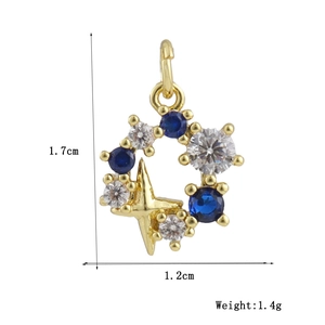 Detailed view of a gold star pendant with blue zircon stones, size 1.7cm by 1.2cm