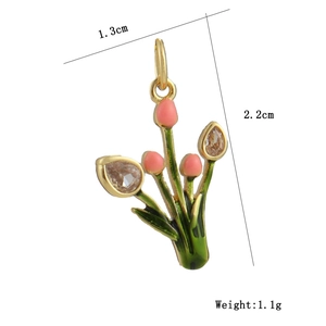 Macro detail of tulip pendant with green enamel and clear cubic zirconia stones