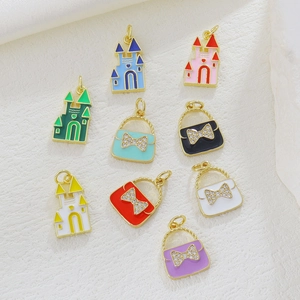 Detail of 18k gold plated castle and handbag charms with colorful enamel and zircons