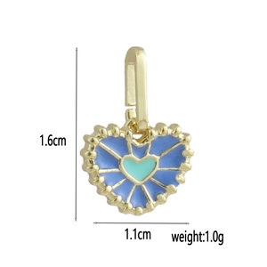 Detail showing blue heart charm in 18k gold plating with size 1.6x1.1cm and 1g weight