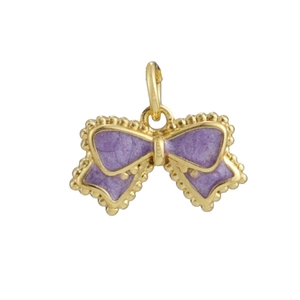 Macro detail of a 18k gold plated bow pendant with purple enamel for DIY jewelry making