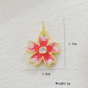 Detail of 1.7cm cherry blossom pendant with enamel petals and zircon center
