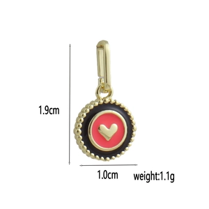 Detail view of 18k gold plated heart charm with dimensions 1.9cm height and 1.0cm width