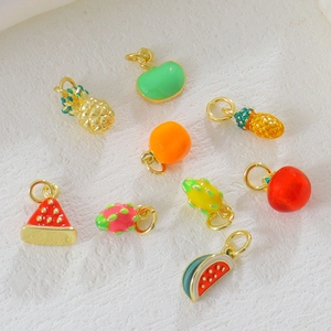 Close-up of assorted 18k gold plated fruit pendants with colorful enamel for DIY jewelry