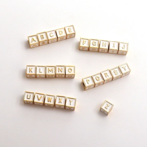 26-piece set of white and 18k gold plated alphabet beads for DIY jewelry making