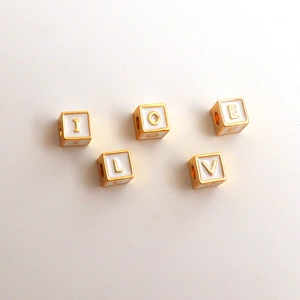 18k gold plated square alphabet beads with white enamel finish spelling LOVE