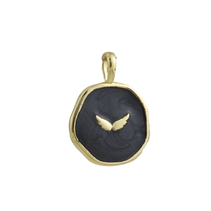 Detailed macro view of 18k gold plated wing pendant with black enamel finish