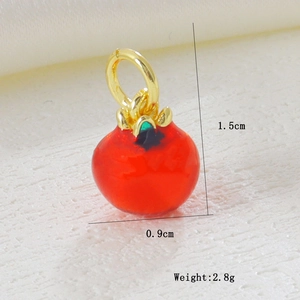 Macro view of persimmon pendant with gold plating and red enamel including dimensions