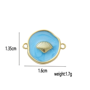 Detailed size view of 18k gold heart fish tail charm with blue enamel and shell inlay