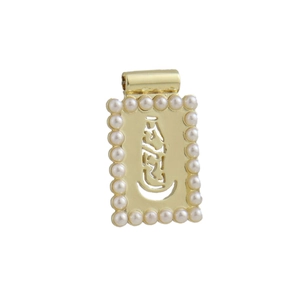 Close-up of 18k gold plated rectangular pendant with pearl border and hollow center