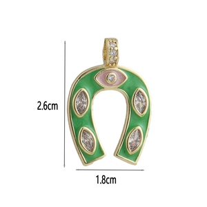 Detailed size view of a 2.6cm emerald horseshoe pendant with pink evil eye charm