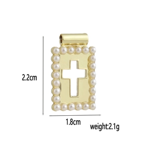 Detail view of 18k gold plated rectangle pendant with cross and white pearls