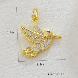 Detailed view of a gold hummingbird pendant with white rhinestones measuring 2.0x1.7cm