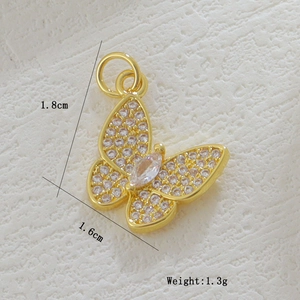 Detail of 18k gold butterfly pendant with cubic zirconia inlay, size 1.8cm x 1.6cm