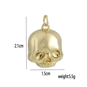 Polished 18k gold plated skull pendant showing dimensions 2.1cm height and 1.5cm width