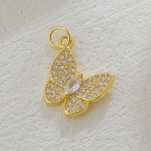 Close-up of 18k gold plated butterfly pendant with micro-pave white zircon details