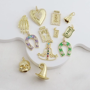 Detailed display of 18k gold plated charms with zircon and pearl inlays for DIY jewelry