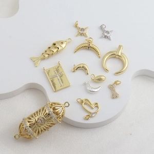 Detailed collection of 18k gold bone, star and fish pendants for DIY jewelry designs