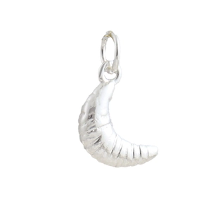 Macro shot of silver croissant pendant with detailed spiral texture for DIY jewelry