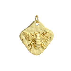 Macro view of gold-plated 18k hammered rhombus pendant featuring a 3D bee relief detail