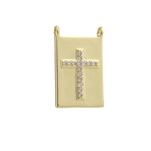 Detail of 18k gold plated bone-shaped pendant with sparkling cross zircon stones