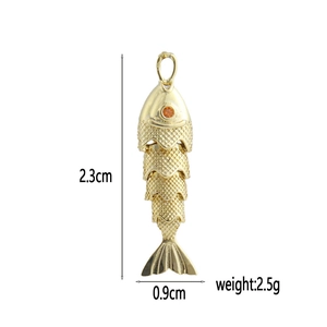 Articulated fish-shaped 18k gold plated bone pendant with dimensions 2.3cm and 0.9cm