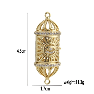 Detailed view of 18k gold plated bone-style hollow evil eye pendant with CZ diamonds