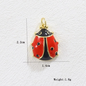 Detailed view of red enamel ladybug pendant with 18k gold plating showing size measurements