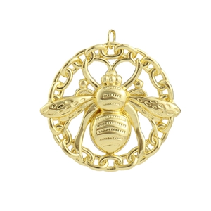 Detailed view of a golden bee pendant with an embossed body and circular chain frame