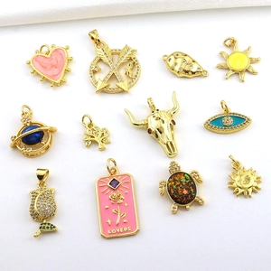 Detailed set of 18k gold plated charms featuring turtle, sun, and heart bohemian motifs